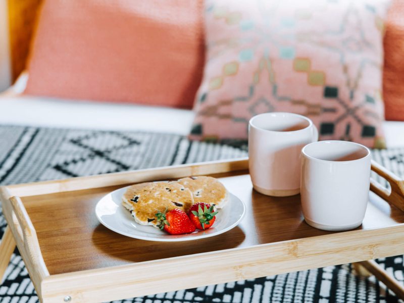 Coffee and Welsh cakes on tray in glamping cabin